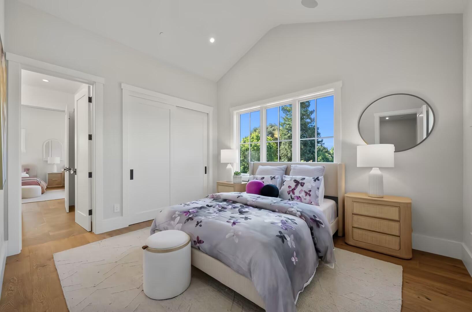 Soft neutral bedroom opening toward the garden
