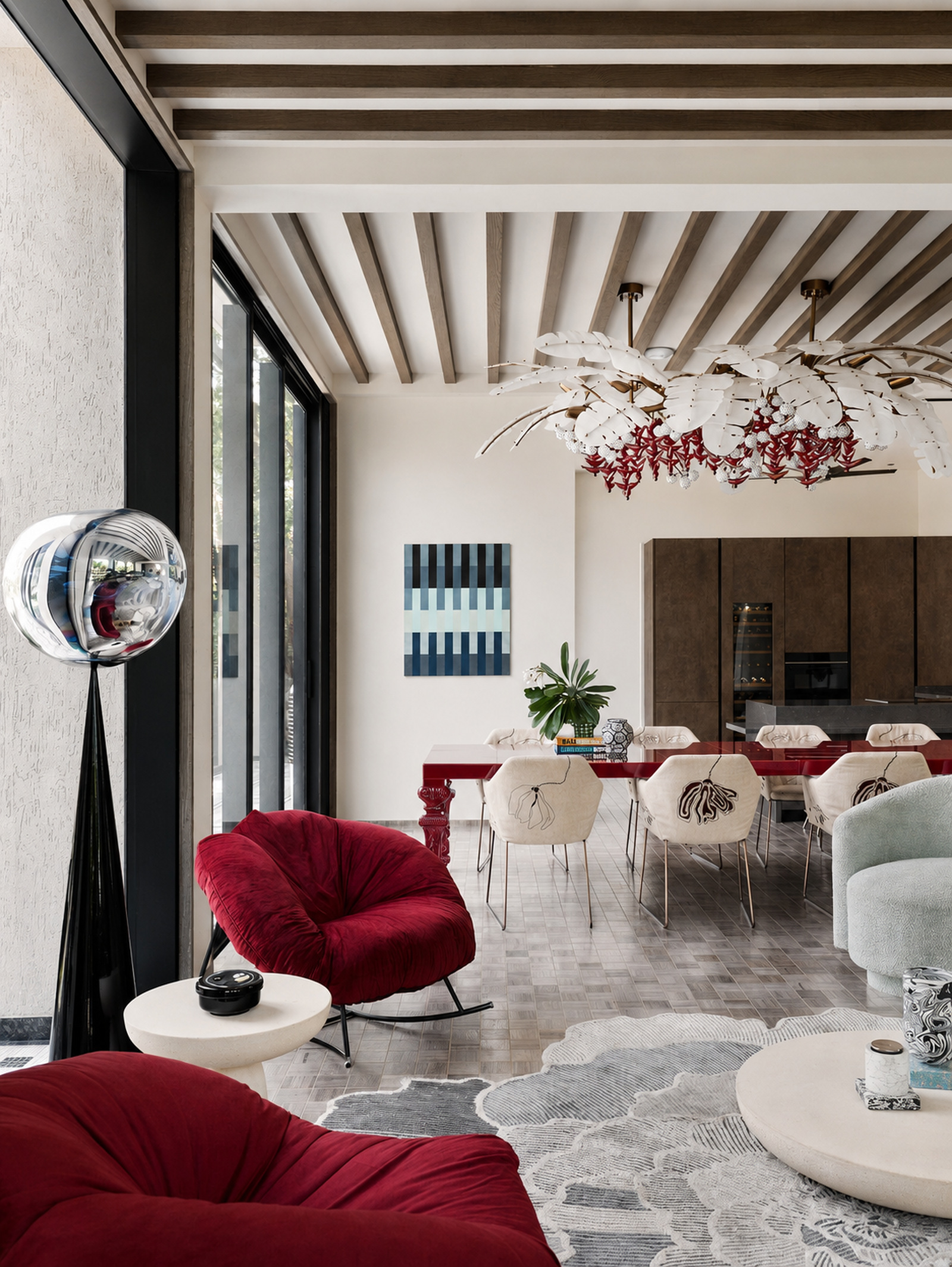 Contemporary dining room with sculptural lighting in a tropical modern Indian villa